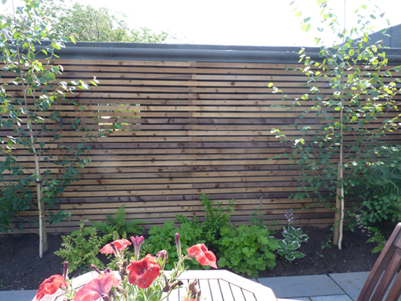 After: a stylish screen provides a lovely backdrop to the new patio