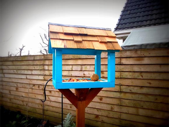 The upcycled bird table has a cedar roof and lead flashing!