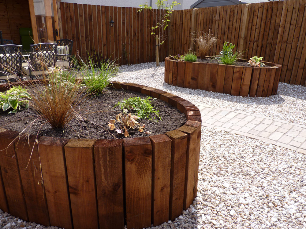 Using vertical timbers allows the raised beds to be beautiful ovals