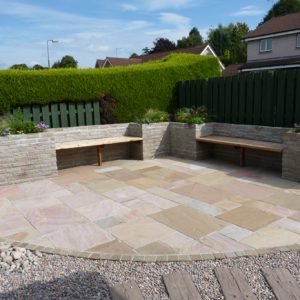 After: a large sandstone patio for entertaining is a key part of the new garden