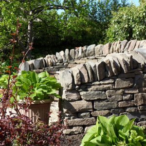 A dry-stane seat creates a wonderful focal points as well as a place to rest on your journey round the garden