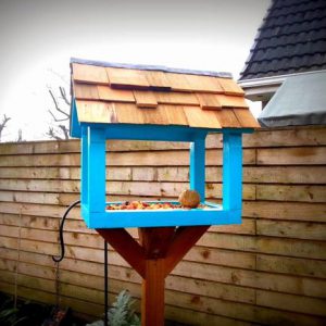 The upcycled bird table has a cedar roof and lead flashing!