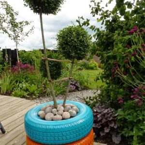 The upcycled tyres painted bright colours