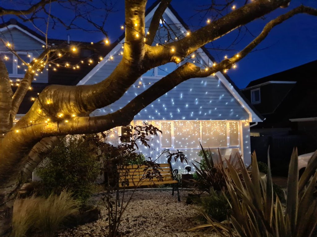 Our house lit up with some festive lights