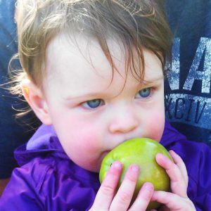 Me when I was littler, eating one of our home grown apples