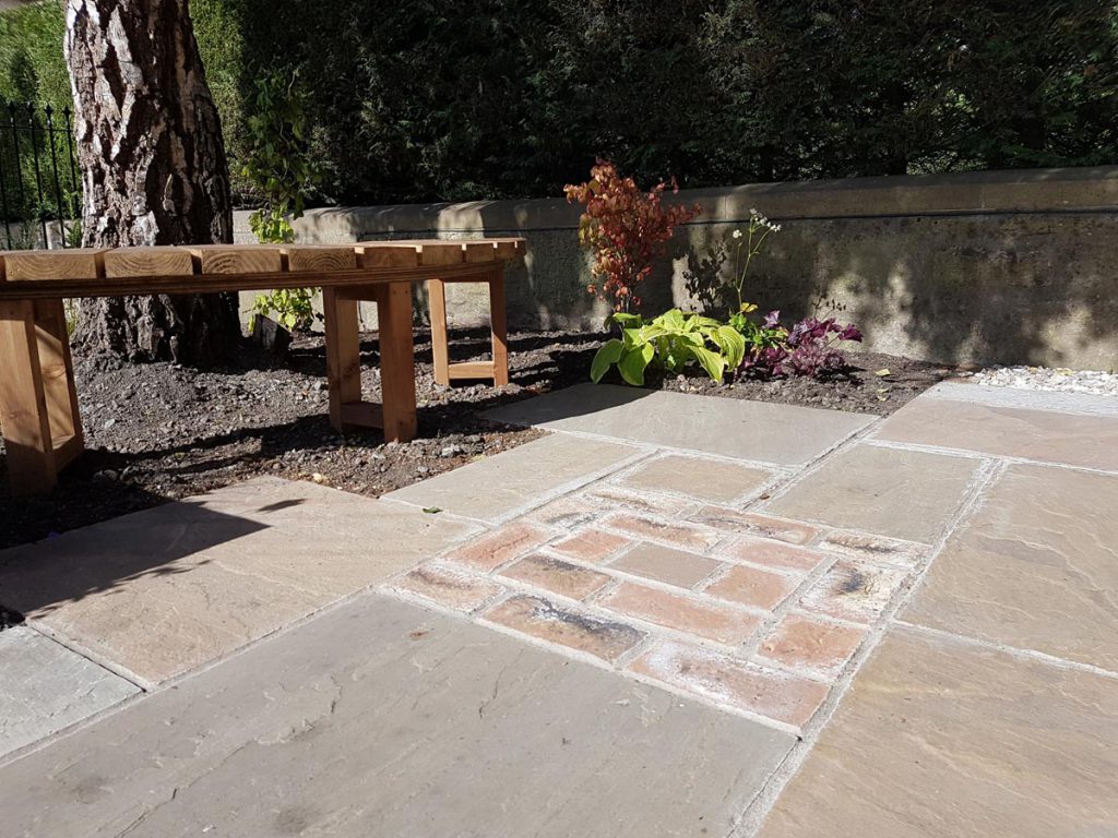 Add some bricks into your paving to add interest