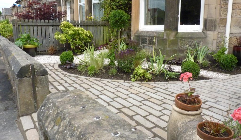 Cobbles, softened by planting creates a stunning path