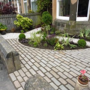 The cobbled path leads you around the garden