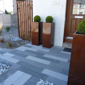 Stunning planters are strong features at the front door