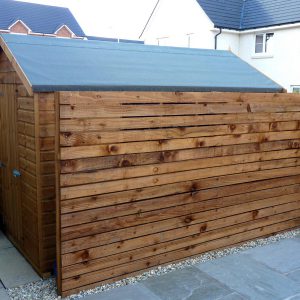 A timber screen helps disguise the shed