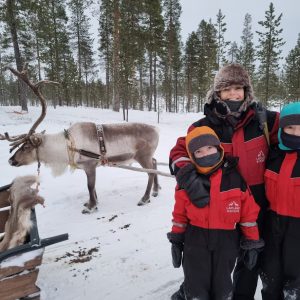 Us with reindeer in Lapland