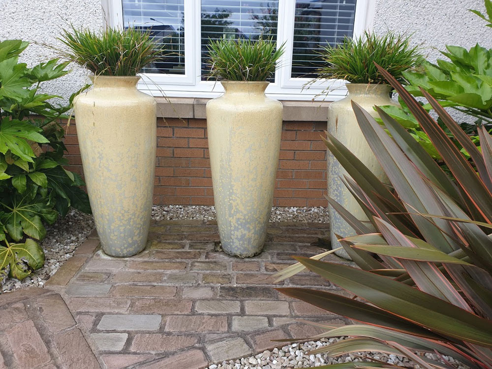 Three ceramic planters look great grouped together providing year round interest