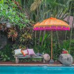 A colourful parasol will create a cool vibe in your garden