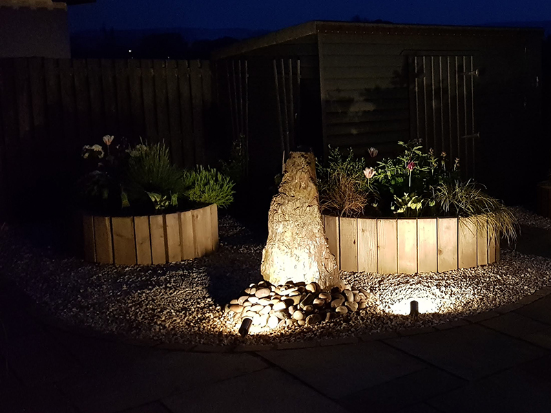 Uplighters beside water features look effective and light up your garden