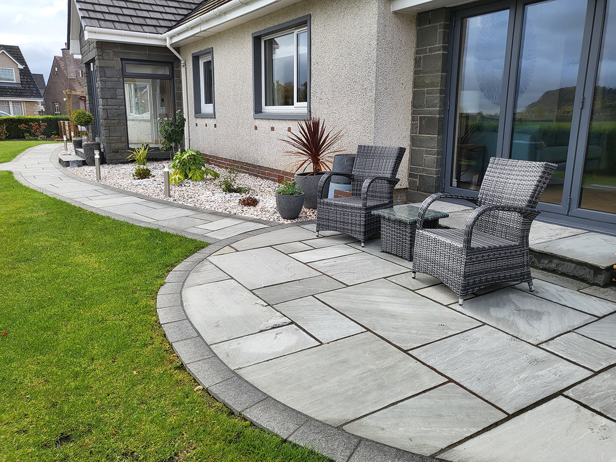 The new curving sandstone patio