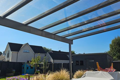 The glass roof to the pergola allows light in