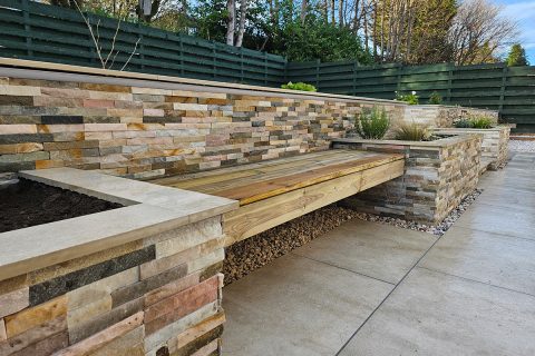 Bespoke in-built seating between the raised beds