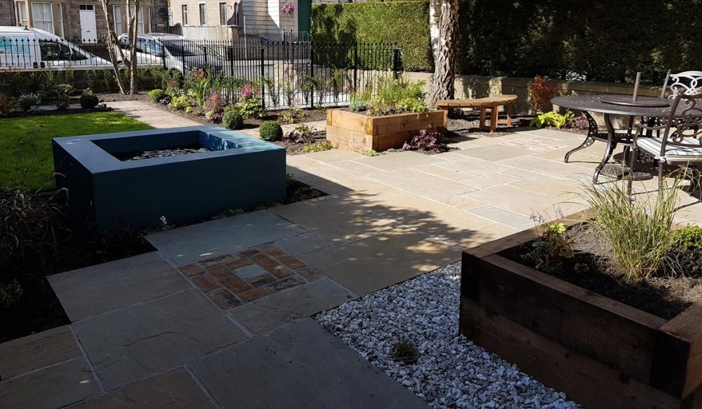 This front garden in Perth has seating, water feature, raised beds and much more.